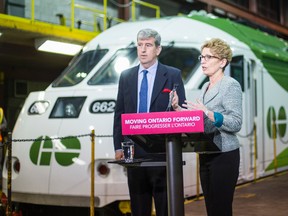 Ontario Premier Kathleen Wynne and Transportation Minister Glen Murray at GO Transit’s Willowbrook Rail Maintenance Facility on April 17, 2014. (Ernest Doroszuk/Toronto Sun file photo)