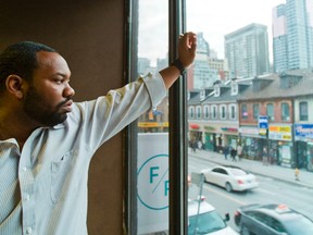 Wu Tang Clan's rapper Raekwon looks out at the streets of Toronto at the office of his Canadian label - Ice H20 in downtown Toronto on Monday November 28, 2011.  (Ernest Doroszuk/QMI AGENCY)