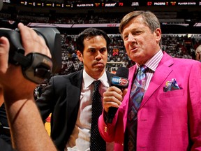 Head Coach Erik Spoelstra of the Miami Heat is interviewed by Craig Sager while his team plays against the Indiana Pacers in Game Five of the Eastern Conference Finals during the 2013 NBA Playoffs on May 30, 2013 at American Airlines Arena in Miami, Florida. (Issac Baldizon/NBAE via Getty Images/AFP)