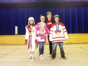 From left: Miriam Epp, Hayley Marcotte, Carla MacLeod, Ben Rhodes. Two time Olympian Carla McLeod visited Whitecourt Central School on Thursday, April 10 allowing the students to wear her medals and official clothing from the Olmpics and the World Championships.
submitted
