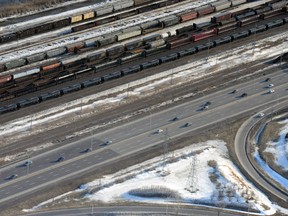 Dozens of DOT-111 tankers parked on the railroad tracks.

MAXIME LANDRY/QMI Agency