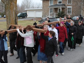 People from all Christian denominations  in north Kanata came together on Good Friday for the Walk of the Cross where groups take turns carrying a large wooden cross through the streets. The march is meant for people to reflect on Jesus Christ's walk to his own crucifixtion. 
JESSIE ARCHAMBAULT/OTTAWA SUN/QMI AGENCY