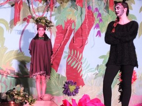 Grade eight students Alena Beniamin, left, and Erica Fontes, right get into character for the Notre Dame production of The Jungle Book. (BRENT BOLES, The London Free Press)