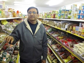 Owner Anil Gupta in the spice aisle of Indo-Asian Groceries and Spices. (Marlene Cornelis, Neighbours)