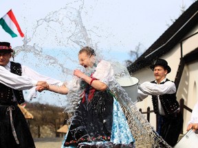 Men throw water onto a woman as part of traditional Easter celebrations during a media presentation in Holloko, east of Budapest, March 28, 2012. Locals from the village of Holloko celebrate Easter with the tradition "watering of the girls," a Hungarian tribal fertility ritual rooted in the area's pre-Christian past. (Laszlo Balogh/Reuters)