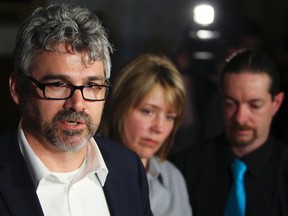 Glen Canning, father of Rehtaeh Parsons, speaks to the media along side Leah Parsons, mother of Rehtaeh Parsons, and her partner, Jason Barnes at Parliament Hill in Ottawa on April 23, 2013. (Andre Forget/QMI Agency)