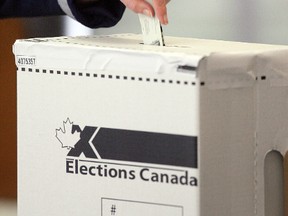 A voter cast their ballot at a polling station in Edmonton in this May 2, 2011 file photo. (DAVID BLOOM/QMI Agency)