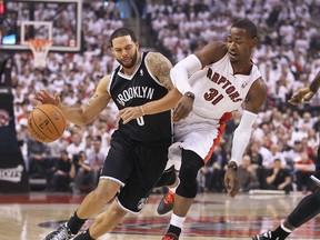Deron Williams #8 of the Brooklyn Nets plays against Terrence Ross #31 of the Toronto Rapters in Game One of the NBA Eastern Conference play-offs at the Air Canada Centre on April 19, 2014 in Toronto, Ontario, Canada. (Claus Andersen/Getty Images/AFP)