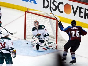 Colorado Avalanche center Paul Stastny (26) scores the game winning goal during the overtime period of game one of the first round of the 2014 Stanley Cup Playoffs against the  Minnesota Wild at Pepsi Center on Apr 17, 2014 in Denver, CO, USA. (Chris Humphreys/USA TODAY Sports)