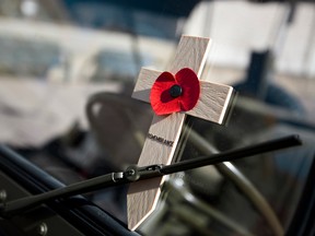 A remembrance cross is seen on the window of a Willys truck as army cadets marched in commemoration of the Battle of Vimy Ridge .

Ian Kucerak/QMI Agency