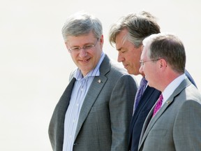 Prime Minister Stephen Harper (L), walks with Canadian Ambassador to the United States Gary Doer (C).

REUTERS/Joshua Roberts