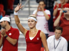 Canada's Eugenie Bouchard waves to the crowd after defeating Slovakia's Kristina Kucova during their Fed Cup tennis match at the PEPS stadium at Laval University in Quebec City, April 19, 2014. (REUTERS/Mathieu Belanger)