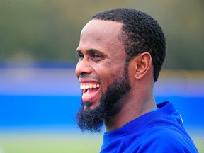 Toronto Blue Jays shortstop Jose Reyes laughs as the Blue Jays work out at the Bobby Mattick Training Center in Dunedin on Feb. 21, 2014. (DAVID MANNING/USA TODAY Sports)
