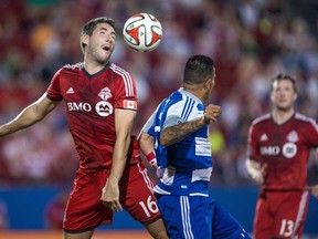 Toronto FC defender Bradley Orr (16) and FC Dallas forward Blas Perez (7) fight for the ball during the second half at Toyota Stadium. FC Dallas defeated Toronto FC 2-1. (Jerome Miron-USA TODAY Sports)