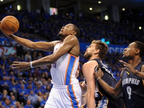 Oklahoma City Thunder forward Kevin Durant attempts a shot against Memphis Grizzlies centre Marc Gasol during Game 1 of their Western Conference quarterfinal series at Chesapeake Energy Arena in Oklahoma City, April 19, 2014. (MARK D. SMITH/USA TOday)