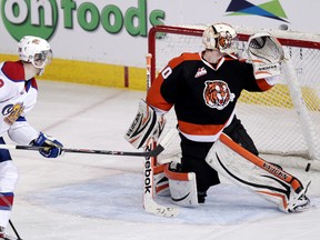 The Edmonton Oil Kings Brett Pollock (39) scores on the Medicine Hat Tigers goalie Marek Langhamer (30) during second period WHL playoff action at Rexall Place, in Edmonton Alta., on Friday April 18, 2014. David Bloom/Edmonton Sun/QMI Agency