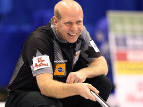 Skip Kevin Martin has a chuckle during the Roar of the Rings Canadian Olympic curling trials at MTS Centre in Winnipeg, Man., on Wed., Dec. 4, 2013. Kevin King/Winnipeg Sun/QMI Agency