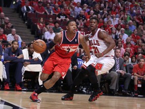 Washington Wizards guard Bradley Beal (3) drives around Chicago Bulls guard Jimmy Butler (21) during the second quarter of game one of the first round of the 2014 NBA Playoffs at the United Center on Apr 20, 2014 in Chicago, IL, USA. (Dennis Wierzbicki/USA TODAY Sports)