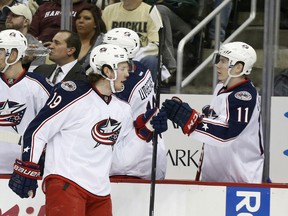 Blue Jackets center Ryan Johansen (left) is congratulated by left wing Matt Calvert after scoring against the Pittsburgh Penguins in the first period of Game 2 of their first-round playoff series on Saturday. (Reuters)