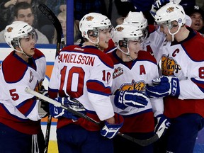 The Edmonton Oil Kings Ashton Sautner (5), Henrik Samuelsson (10), Curtis Lazar (27)), Griffin Reinhart (8), celebrate Lazar's third period goal against the Prince Albert Raiders, during WHL action at Rexall Place, in Edmonton Alta., on Saturday March 22, 2014. David Bloom/Edmonton Sun/QMI Agency