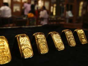 Gold biscuits are displayed inside a jewellery showroom in the southern Indian city of Hyderabad April 11, 2012.
REUTERS/Krishnendu Halder