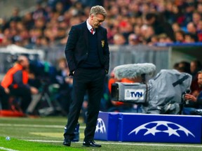 Manchester United's manager David Moyes reacts after their Champions League quarter-final second leg soccer match against Bayern Munich in Munich, April 9, 2014. (REUTERS/Michael Dalder)