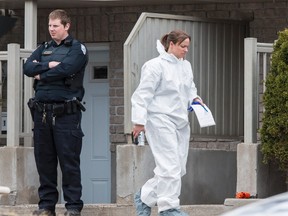 Gatineau Police investigate the murder of 42-year-old Angela Distasio at her apartment at 45 Rue Symmes in the Aylmer area of Gatineau. April 21, 2014. Errol McGihon/Ottawa Sun/QMI Agency