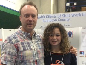 Victoria Dabanovich, 13, and her stepfather Dr. John O'Mahony, pictured here at the Lambton County Science Fair this month. Dabanovich researched the impact of shift work on health. For her research, she won the Pembina Safety Award and the brozne award from TransCanada Pipeline in the junior division. SUBMITTED PHOTO
