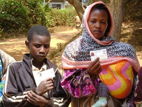 Lushoto, Tanzanian residents display the medical insurance card made possible through donations to Hearts for Lushoto.