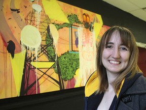 Olivia Locksley, a graduate in the Bachelor of Fine Art program at Queen's University, stands in front of one of her works on display for a year-end exhibition at Ontario Hall in Kingston, Ont. on Monday.
MICHAEL LEA\THE WHIG STANDARD\QMI AGENCY.
