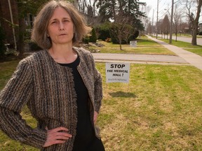 Kelley McKeating is organizing a protest against a new medical building being built at Victoria and Richmond streets where construction preparation, below, was under way Monday. (MIKE HENSEN, The London Free Press)