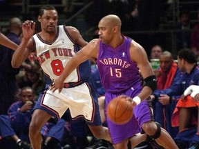 Raptors' Vince Carter dribbles the ball past Knicks' Latrell Sprewell in Game 2 of their playoff series in 2000. The Raptors lost on a heartbreaking shot by Sprewell. (AFP files)