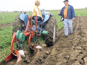 Lynda Prong, first Queen of the Furrow, receives a thumbs up from Duncan McPhail, chairman of the 2010 Elgin-St. Thomas International Plowing Match, plowing a ceremonial plot during the Queen of the Furrow plowing competition in this file photo. Legacy funds from the plowing match provide annual scholarships to St. Thomas and Elgin post-secondary students studying an agriculture-related discipline. Applications for the scholarship are now open.