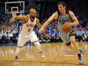 Memphis Grizzlies guard Beno Udrih drives to the basket against Oklahoma City Thunder guard Derek Fisher during Game 2 of their Western Conference quarterfinal series at Chesapeake Energy Arena in Oklahoma City, April 21, 2014. (MARK D. SMITH/USA Today)