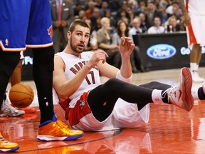 Toronto Raptors' Jonas Valanciunas on the floor during a game at the Air Canada Centre against the New York Knicks on April 11, 2014. (Stan Behal/Toronto Sun/QMI Agency)