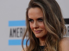 Actress Alicia Silverstone arrives at the 41st American Music Awards in Los Angeles, California November 24, 2013.(REUTERS/Mario Anzuoni)