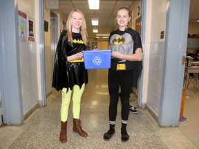 Holy Name of Mary Catholic School students Katie Weese and Paige McFarlane were 'superheroes for the Earth' Tuesday while Celebrating Earth Day at the school. 
Emily Mountney/The Intelligencer