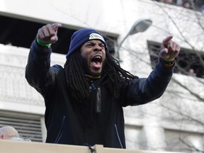 Seattle Seahawks' Richard Sherman yells to fans during the NFL team's Super Bowl victory parade in Seattle, Washington February 5, 2014. (REUTERS)