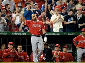 Albert Pujols #5 of the Los Angeles Angels of Anaheim acknowledges the crowd after hitting a two-run home run against the Washington Nationals in the fifth inning at Nationals Park on April 22, 2014 in Washington, DC. The home run home was Albert Pujols' 500th. Patrick Smith/Getty Images/AFP)