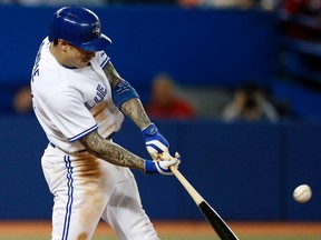 Brett Lawrie hits a three run homer in the eighth inning as the Toronto Blue Jays defeated the Baltimore Orioles 9-3 in an American League East game in Toronto on April 22, 2014. (Michael Peake/QMI Agency)