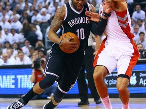 Landry Fields of the Toronto Raptors gets in the lane of Marcus Thornton of the Brooklyn Nets Game 2 of the Eastern Conference playoffs at the Air Canada Centre in Toronto Tuesday, April 22, 2014. Dave Abel/Toronto Sun/QMI Agency