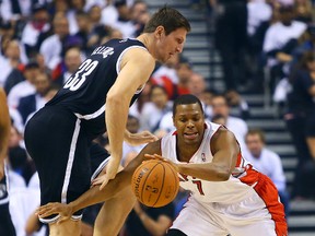 Kyle Lowry of the Toronto Raptors gets around Mirza Teletovic of the Brooklyn Nets during Game 2 of the Eastern Conference playoff series on April 22, 2014. (Dave Abel/Toronto Sun/QMI Agency)
