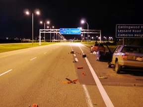 Debris is seen on Anthony Henday Drive in the southbound lanes north of Callingwood Road on June 13, 2012 after a Good Samaritan was killed in a hit and run collision. (SUPPLIED)