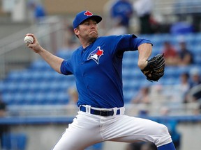 Toronto Blue Jays relief pitcher Casey Janssen throws a pitch during a spring training game March 24, 2014. (KIM KLEMENT/USA TODAY Sports)