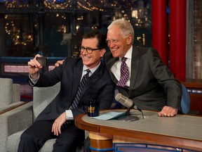 Stephen Colbert and David Letterman pose for a selfie on "The Late Show with David Letterman".