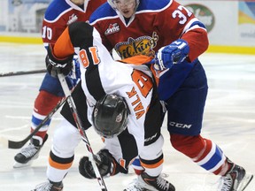 Oil Kings forward Dysin Mayo collides with Tigers forward Curtis Valk during Tuesday’s playoff action at the Arena in Medicine Hat. (Emma Bennett, Medicine Hat News)