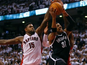 Toronto Raptors forward Amir Johnson (15) and forward Patrick Patterson (54) defend against Brooklyn Nets forward Paul Pierce (34) in Game 2 of the first round of the 2014 NBA Playoffs at Air Canada Centre. (John E. Sokolowski-USA TODAY Sports)