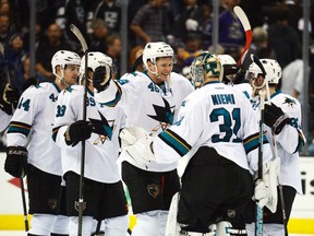 San Jose Sharks goalie Antti Niemi celebrates with teammates after defeating the Los Angeles Kings in Game 3 of their Western Conference quarterfinal series at the Staples Center in Los Angeles, April 22, 2014. (KIRBY LEE/USA Today)