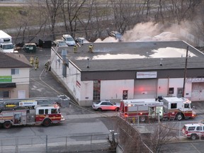 Fire crews work to douse a blaze in the Ming auto repair shop on Breezehill Ave. North on Wednesday morning. (Submitted image David Niemi)