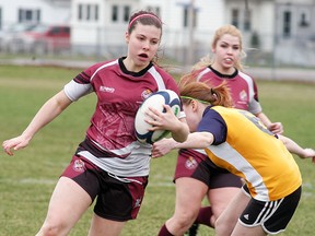 Wallaceburg Tartan girls rugby player Halley Jeffs runs with the ball during a game on April 22 against the Chatham-Kent Golden Hawks in Wallaceburg. The Tartans won their first game of the season with a 47-0 win over the Hawks.
